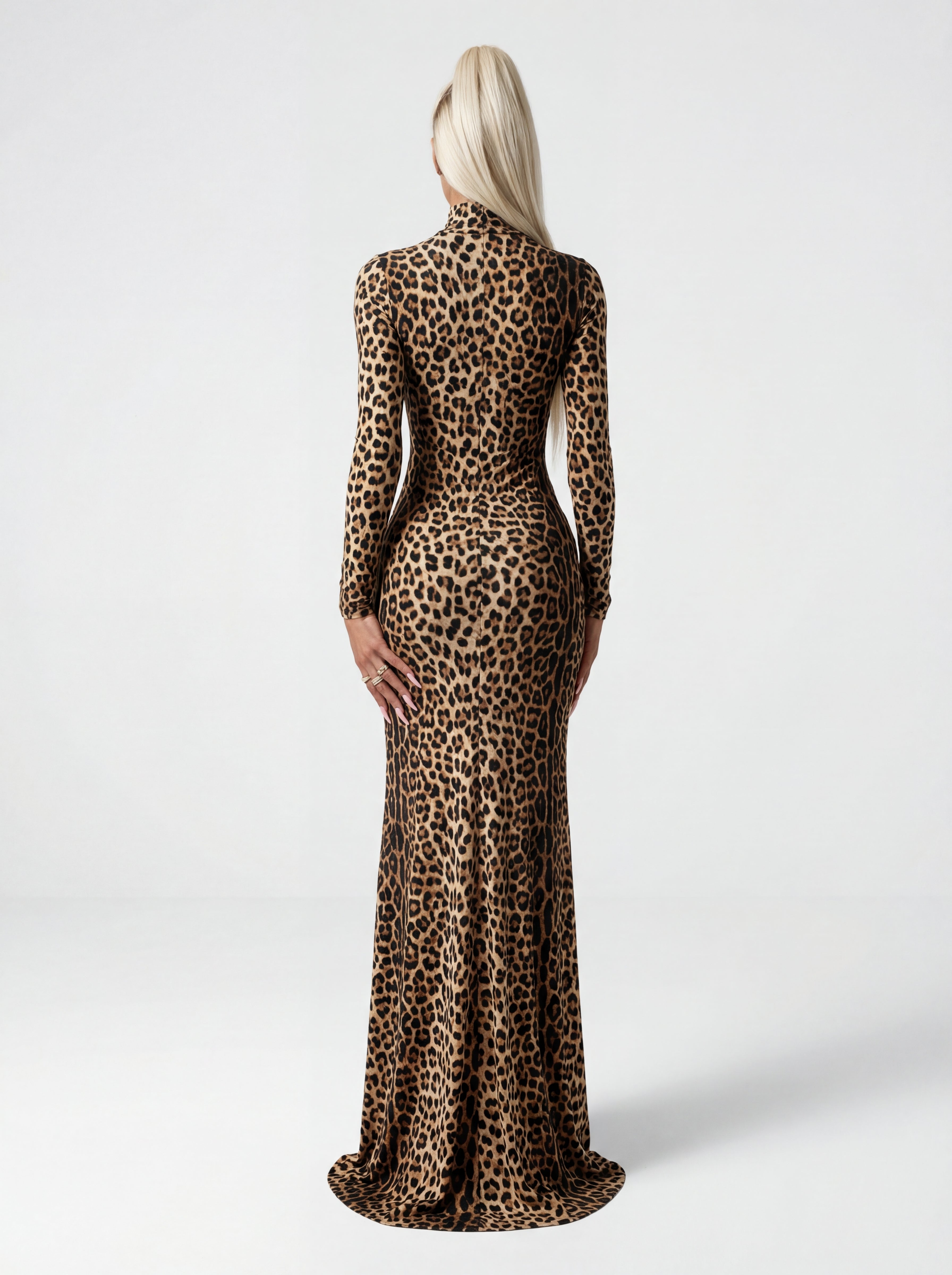 Leopard print dress worn by a model on a white background