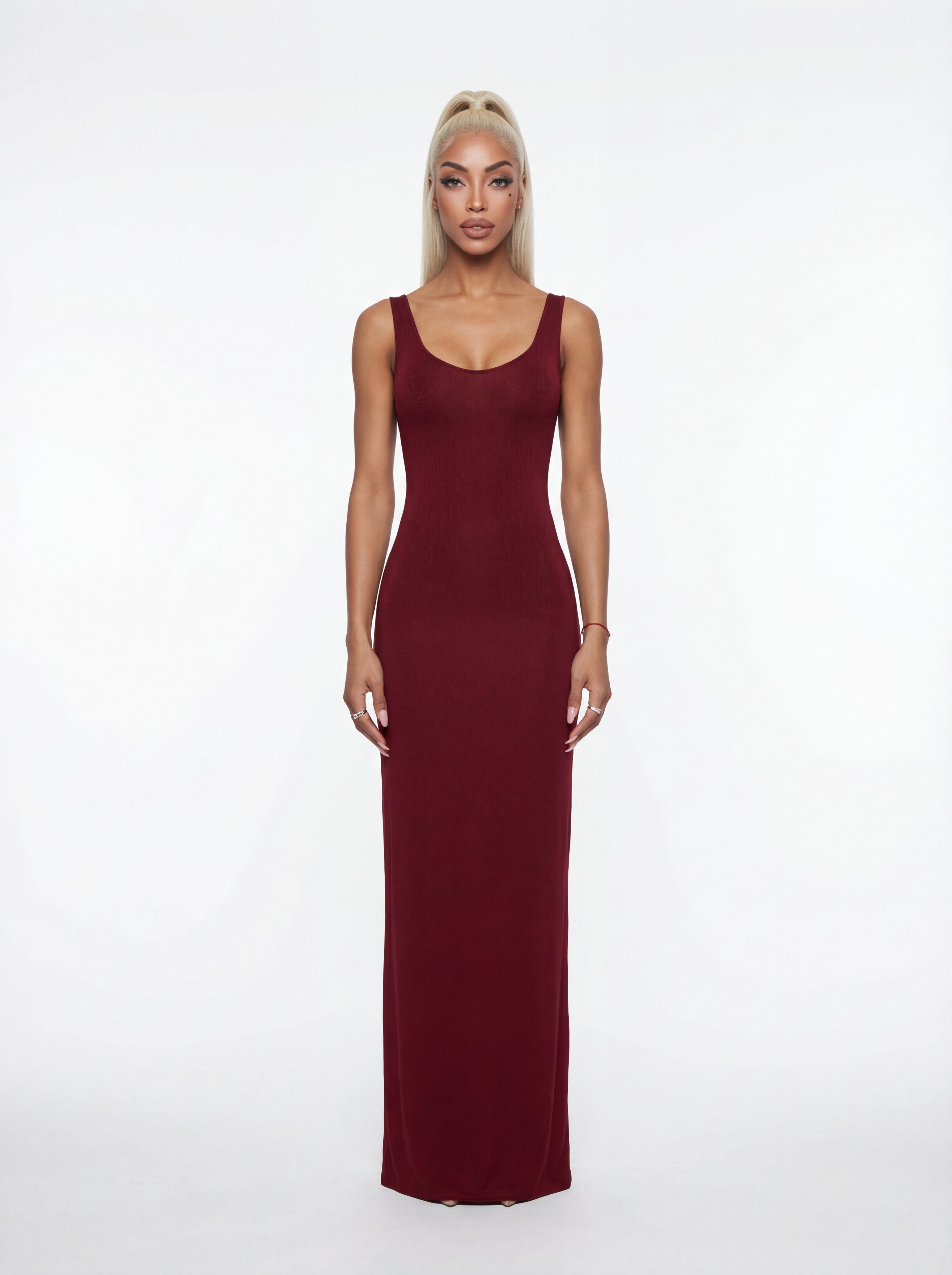 Woman wearing a burgundy dress on a white background